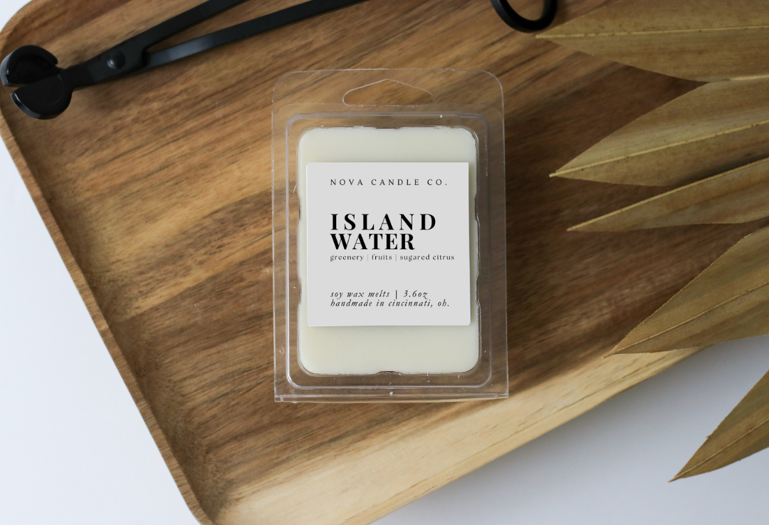 Nova Candle Co. Island Water wax melt on a wooden tray